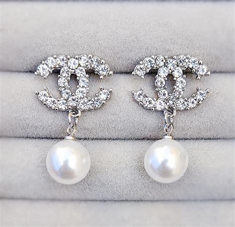 chanel logo and pearl earrings